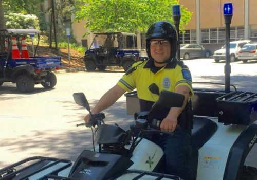 campus police officer on an atv